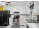Well-lit kitchen featuring white cabinets and modern appliances, ready for cooking at 2056 Merle Se Dr, Conyers, GA 30013