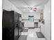 Functional kitchen with white cabinets, stainless steel appliances, and tile flooring at 2056 Merle Se Dr, Conyers, GA 30013