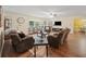 Open-concept living room with hardwood floors and a seamless flow to the dining area at 2056 Merle Se Dr, Conyers, GA 30013