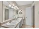 Bathroom featuring double sinks, granite countertops, and tiled floors at 5145 Roswell Road # 3, Atlanta, GA 30342