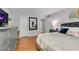Comfortable bedroom with a dresser, mirror, and soft lighting creates a relaxing space at 5145 Roswell Road # 3, Atlanta, GA 30342