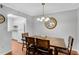 Charming dining area with a wooden table and seating for four is connected to the kitchen at 5145 Roswell Road # 3, Atlanta, GA 30342
