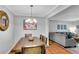 This dining area has a wooden table with seating for four and is adjacent to the living room at 5145 Roswell Road # 3, Atlanta, GA 30342
