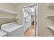 Convenient laundry area accessible from the kitchen, equipped with shelving for organization at 5145 Roswell Road # 3, Atlanta, GA 30342