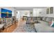Open-concept living room with a sectional sofa, modern decor, and a view of the dining area at 5145 Roswell Road # 3, Atlanta, GA 30342