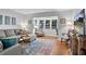 Well-lit living room with a large sectional sofa, modern furniture, and hardwood floors at 5145 Roswell Road # 3, Atlanta, GA 30342