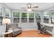 Sunlit office space with a desk, chair, and large windows overlooking a lush green landscape at 5145 Roswell Road # 3, Atlanta, GA 30342
