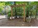 Community swing featuring mature trees and lush landscaping at 5145 Roswell Road # 3, Atlanta, GA 30342