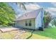 Backyard with a stone patio and a grassy area, perfect for outdoor relaxation and entertainment at 7384 Birch Hollow Pl, Douglasville, GA 30134