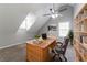 Bright office space with built-in shelving, a large desk, and a comfortable chair, perfect for productivity at 7384 Birch Hollow Pl, Douglasville, GA 30134