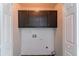A convenient laundry area with washer/dryer hookups and extra storage cabinets at 7384 Birch Hollow Pl, Douglasville, GA 30134
