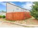Cozy fenced backyard with string lights, offering a private and relaxing outdoor space for entertaining and leisure at 739 Woodstock Grove Dr, Woodstock, GA 30188