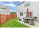 Green backyard with a quaint patio and modern outdoor seating, ideal for entertaining guests at 739 Woodstock Grove Dr, Woodstock, GA 30188