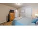Bedroom featuring a bed with a neutral-colored comforter set and light-filled windows at 739 Woodstock Grove Dr, Woodstock, GA 30188