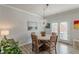 Dining area with a round wood table and french doors at 739 Woodstock Grove Dr, Woodstock, GA 30188