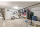 Finished garage with upper storage and entertainment setup, offering versatility and functionality at 739 Woodstock Grove Dr, Woodstock, GA 30188