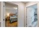Upstairs hallway boasting hardwood floors and views to the bedrooms at 739 Woodstock Grove Dr, Woodstock, GA 30188
