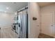 Kitchen with stainless steel appliances and gray cabinets at 739 Woodstock Grove Dr, Woodstock, GA 30188