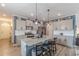 Eat-in kitchen with granite island, stainless steel appliances and open to the dining area at 739 Woodstock Grove Dr, Woodstock, GA 30188