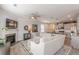 View of the living room featuring a fireplace and a cozy sectional sofa at 739 Woodstock Grove Dr, Woodstock, GA 30188