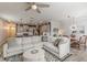 Open floor plan showcasing the living room with large sectional sofa, dining area, and kitchen at 739 Woodstock Grove Dr, Woodstock, GA 30188