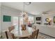 Open-concept living space combining the dining area and living room for seamless entertaining at 739 Woodstock Grove Dr, Woodstock, GA 30188