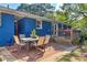 Brick patio with an outdoor dining set and a wooden deck at 854 Parkway Se Dr, Smyrna, GA 30080