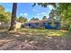 Expansive backyard features a brick patio, dining set, and a wooden deck at 854 Parkway Se Dr, Smyrna, GA 30080
