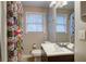 Cozy bathroom featuring a white sink, toilet, and bright shower curtain at 854 Parkway Se Dr, Smyrna, GA 30080