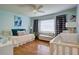 Bright Bedroom featuring a bed, a crib, hardwood floors, and abundant natural light at 854 Parkway Se Dr, Smyrna, GA 30080