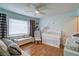 Well lit Bedroom featuring a bed, a crib, hardwood floors, and natural light at 854 Parkway Se Dr, Smyrna, GA 30080