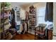 Walk-in closet featuring built in shelving, natural lighting, and hardwood floors at 854 Parkway Se Dr, Smyrna, GA 30080