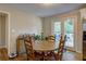 Cozy dining area with wood floors, round table, and access to outdoor deck at 854 Parkway Se Dr, Smyrna, GA 30080