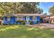 Charming blue brick home with well-maintained lawn, flower boxes, and carport at 854 Parkway Se Dr, Smyrna, GA 30080