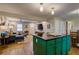 Spacious kitchen island with seating connects to a living room, for seamless entertaining in this open concept home at 854 Parkway Se Dr, Smyrna, GA 30080