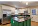 Modern kitchen with stainless steel appliances, an island, and bright green cabinets stands out at 854 Parkway Se Dr, Smyrna, GA 30080