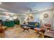 Open-concept living room area with hardwood floors, ceiling fan, and stylish furniture and décor at 854 Parkway Se Dr, Smyrna, GA 30080