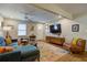 Living area features hardwood floors, a ceiling fan, comfortable seating, and access to other rooms at 854 Parkway Se Dr, Smyrna, GA 30080