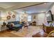 Comfortable living room boasts hardwood floors, stylish furniture, and plenty of natural light from large windows at 854 Parkway Se Dr, Smyrna, GA 30080