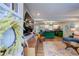 Open concept space with hardwood floors leads from living room to kitchen with bright green cabinetry at 854 Parkway Se Dr, Smyrna, GA 30080