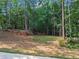 Spacious backyard lot surrounded by mature trees, providing ample space for outdoor activities at 1126 Wedgefield Sw Dr, Marietta, GA 30064