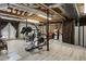 Workout area in the basement has exposed duct work, wood floors, and workout equipment at 1126 Wedgefield Sw Dr, Marietta, GA 30064