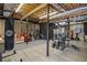Spacious finished basement featuring exercise equipment, a punching bag, and a cozy seating area at 1126 Wedgefield Sw Dr, Marietta, GA 30064