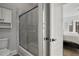 Bathroom featuring a shower with sliding glass doors and bright lighting at 1126 Wedgefield Sw Dr, Marietta, GA 30064