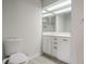 Clean bathroom features a toilet, vanity with sink, and a large mirror at 1126 Wedgefield Sw Dr, Marietta, GA 30064