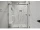 Modern bathroom features a large shower with glass doors and a built-in bench at 1126 Wedgefield Sw Dr, Marietta, GA 30064
