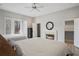 Bright bedroom featuring a fireplace, balcony access, and walk-in closets at 1126 Wedgefield Sw Dr, Marietta, GA 30064