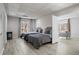 Spacious bedroom features neutral walls, wood floors, recessed lighting, and two twin beds with grey comforters at 1126 Wedgefield Sw Dr, Marietta, GA 30064