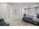 Spacious bedroom features neutral walls, wood floors, recessed lighting, and an ensuite bathroom at 1126 Wedgefield Sw Dr, Marietta, GA 30064