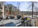 Large deck features outdoor kitchen and dining area, ideal for entertaining and enjoying the beautiful lake views at 1126 Wedgefield Sw Dr, Marietta, GA 30064